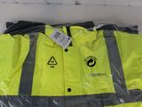 a yellow jacket with a black and white logo on it