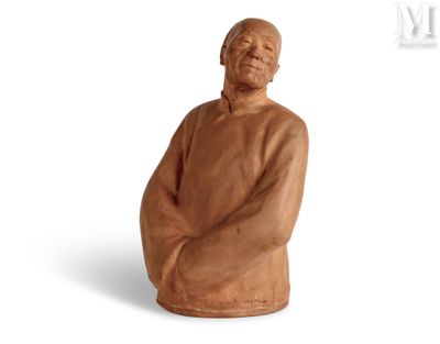 statue of an old man sitting on a chair with his arms crossed