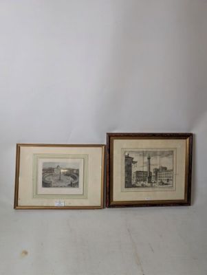 two framed pictures of a building and a vase on a table