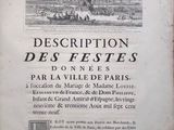 an old book with a picture of a city in the background