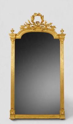 une image d'un miroir encadré d'or sur un fond blanc