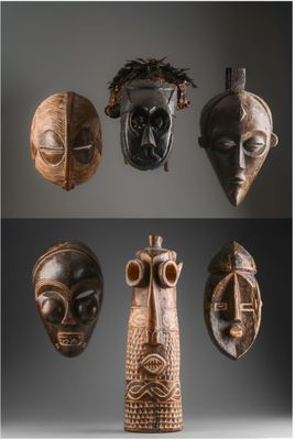 Plusieurs masques africains sont exposés sur un fond noir