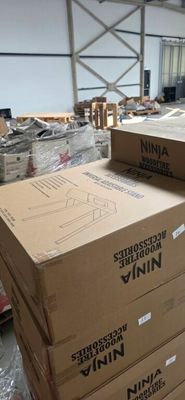many boxes stacked on top of each other in a warehouse