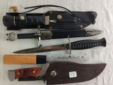 several different types of knives are lined up on a table