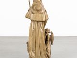 an image of a statue of a woman holding a bird