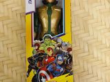 the avengers action figure is in the box on the table