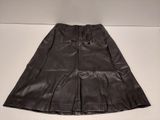 a black leather skirt on a white surface