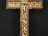 an old wooden cross with a cross on it on a black background