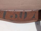 a close up of a piece of wood with writing on it