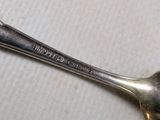 a spoon that has a spoon on it on a table