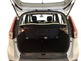 the back end of a white car with its trunk open