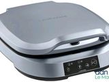 an image of a close up of a waffle maker on a white background