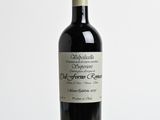 a bottle of wine that is sitting on a table