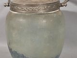 a glass jar with a lid and a spoon in it