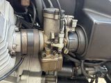 a close up view of a motorcycle engine and its gear
