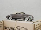 a toy car sitting on top of a cardboard box