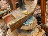 a statue of a cat sitting on top of a table