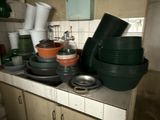 many pots and pans on the counter in the kitchen