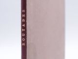 a close up of a book on a table with a white background