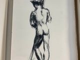 drawing of a man holding a baseball bat in an open book