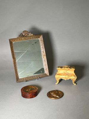 a small mirror and a small mirror on a table