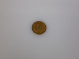 an image of a gold coin on a white surface