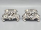 pair of antique silverplated candlesticks with lions and flowers