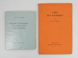 two books sitting on top of a table next to each other