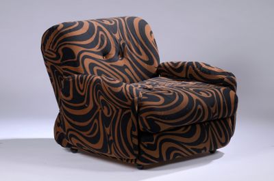 a brown and black zebra print chair on a white background