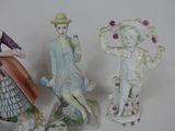 three figurines that are sitting on a table