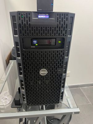 a computer tower on a glass table in a room