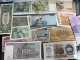 many different types of foreign currency on the table