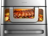 un four à friteuse à air chaud contenant de la viande et des légumes