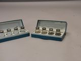 pair of miniature salt and pepper shakers in a blue box
