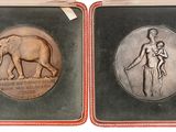 three antique silver and gold plated medallions of a woman and a man