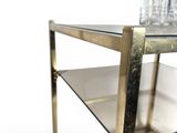 a glass shelf with a bottle on top of it