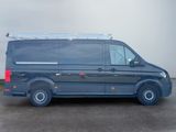 the van is parked in the parking lot near the building
