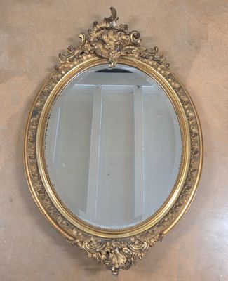 a mirror hanging on the wall in a room