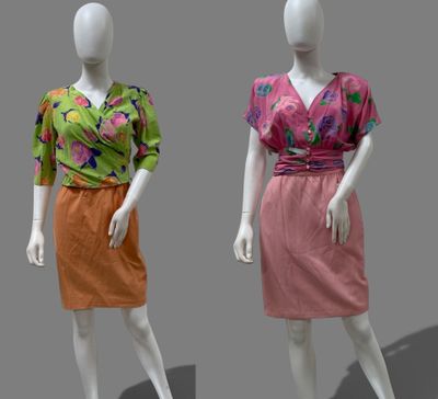 three mannequins dressed in different colors of clothing on display