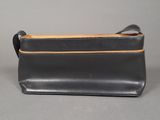 a black leather purse with a zipper on the front