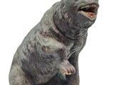 a statue of a bear that is sitting on its hind legs