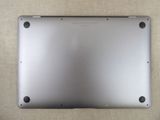 a close up of a silver laptop on a table