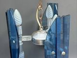 a chandelier made of glass and a candle holder