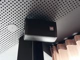 a speaker that is on top of the ceiling