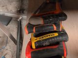a stack of tools sitting on top of each other on the floor
