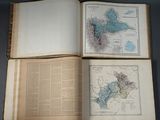 an open book with a map and a map of the world on it