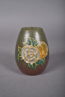 a brown vase with a rose design on it