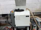 a machine that is sitting on the floor next to other machines