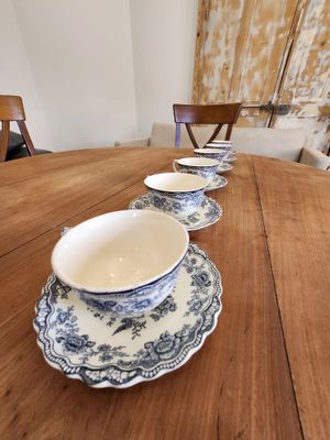 a table with a bunch of plates and bowls on it