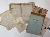a pile of old papers sitting on a table